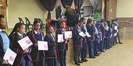 Grade 12 learners at Potchefstroom Secondary School receive their certificates of merit.