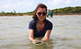 Dr Roksana Majewska holding a juvenile lemon shark.