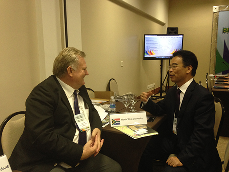 Theo Bekker in discussion with Prof Li Weijian Vice Principal Zhejiang Normal University Jinhua-,China during the BRICS Ministerial meeting  Brasillia, Brazil 2015